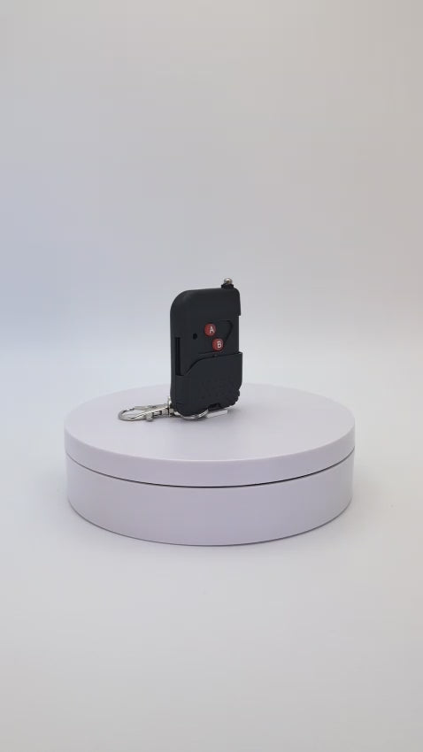 Control remoto inalámbrico de 2 botones FeelSecure. Ideal para activar alarmas a distancia.